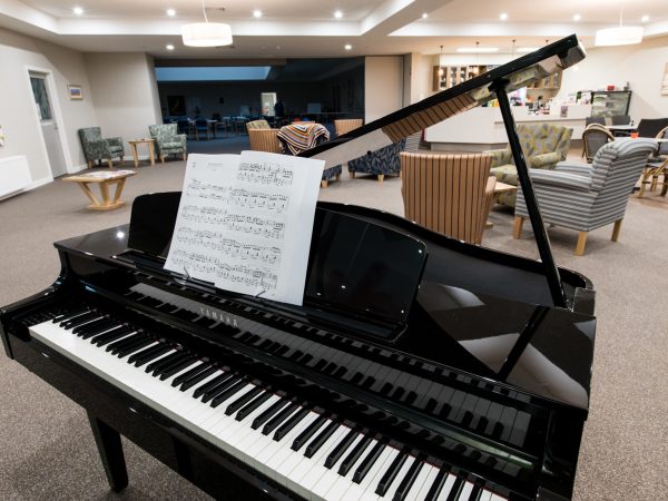 BAPTCARE ABBEY GARDENS Main community hub with grand piano cafe and lounge area