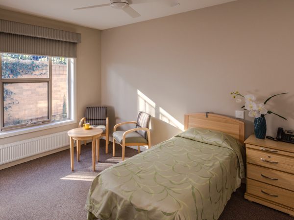 BAPTCARE ABBEY GARDENS Bedroom with view to outside garden vine wallclimbing