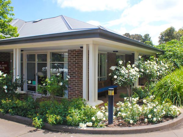 BAPTCARE AMBERLEA view of facility frontage with rose garden