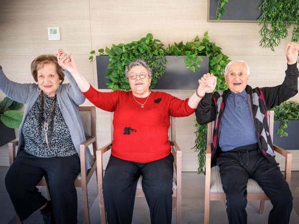 BAPTCARE BROOKVIEW Resident friends doing physical activities stretching and chair dancing