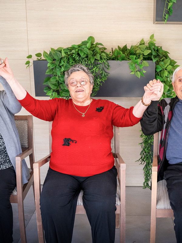 BAPTCARE BROOKVIEW Resident friends doing physical activities stretching and chair dancing