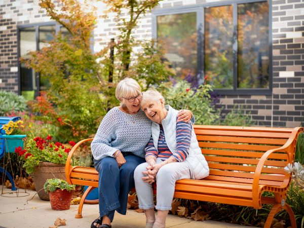 BAPTCARE BROOKVIEW Resident mother with her daughter in the courtyard garden