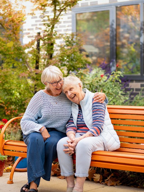 BAPTCARE BROOKVIEW Resident mother with her daughter in the courtyard garden