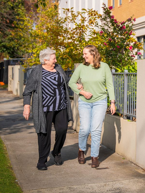 BAPTCARE KARANA Resident mother and daughter walking outside the front entrance