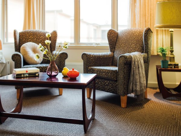 BAPTCARE KARANA bedroom furniture close up of coffee table and comfy chairs