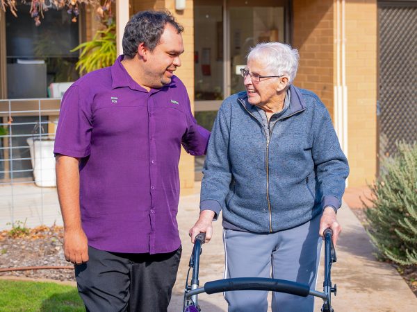 BAPTCARE NORTHAVEN Resident and staff member having a chat while walking