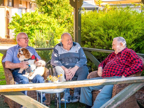 BAPTCARE NORTHAVEN Resident friends sharing stories from their day in the gazebo