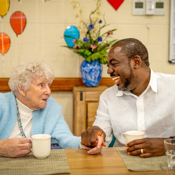 BAPTCARE NORTHAVEN Resident with staff member sharing a laugh