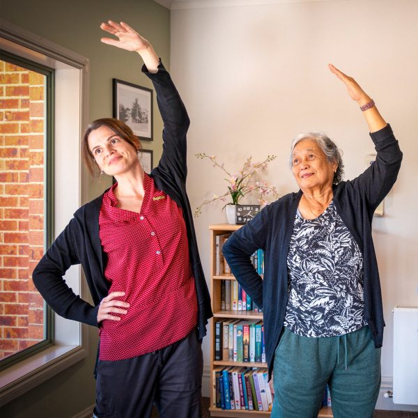 BAPTCARE PENINSULA VIEW resident and staff member stretching activity for wellbeing