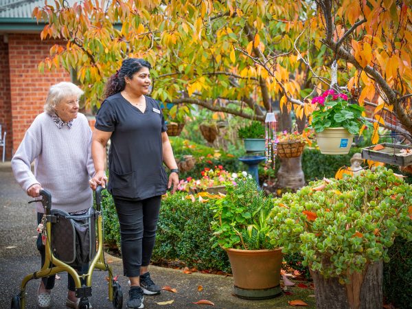 BAPTCARE PENINSULA VIEW resident and staff member enjoying the garden