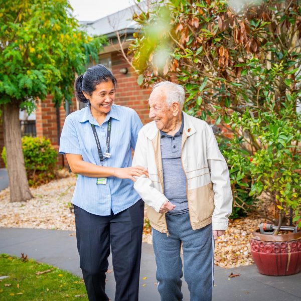 BAPTCARE ST HILARYS Residential Care resident and staff member outside enjoying the garden