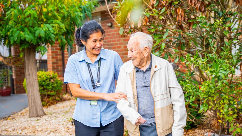 BAPTCARE ST HILARYS Residential Care resident and staff member outside enjoying the garden