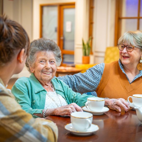 BAPTCARE ST HILARYS Residential Care resident and her daughters enjoying tea