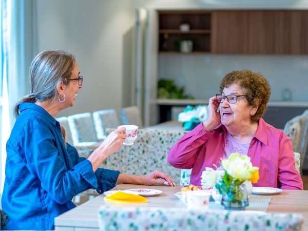 BAPTCARE WATTLE GROVE resident mother and her daughter in conversation over tea