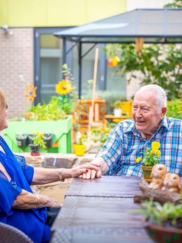 BAPTCARE WATTLE GROVE resident with his daughter in his outdoor area intimate conversation