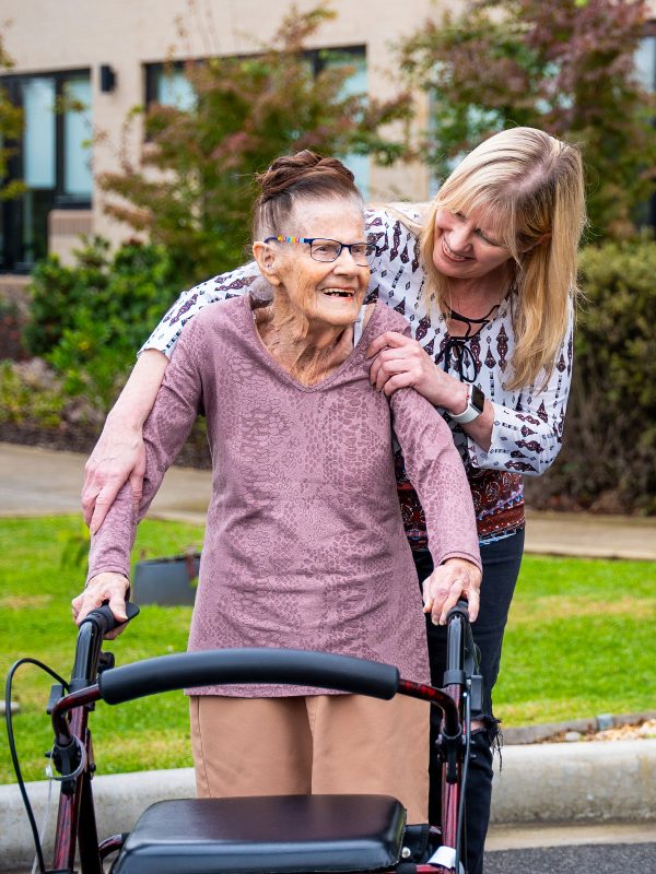 BAPTCARE Wyndham Lodge view of a resident with her daughter smiling and hugging