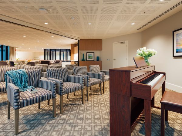 BAPTCARE Wyndham Lodge view of a residential aged care multipurpose room with piano