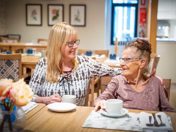 BAPTCARE Wyndham Lodge Mother and Daughter in Cafe chatting