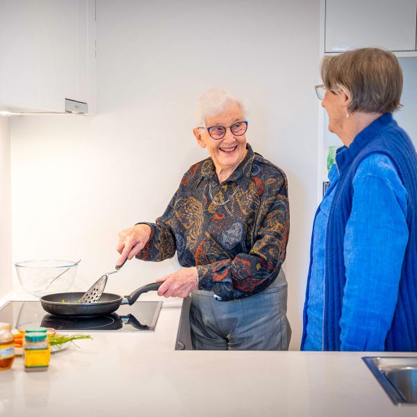 Retirement Living Hedley Sutton Kitchen two residents cooking