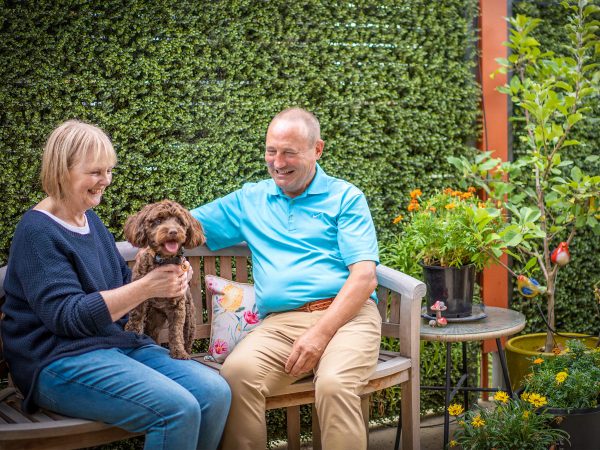 Residents in garden courtyard at their Baptcare Strathalan Retirement Living villa