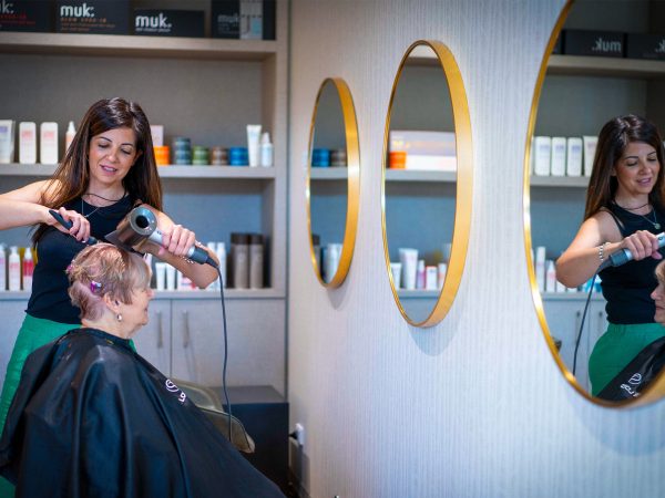Resident at hairdresser at Baptcare Strathalan Retirement Living community hub