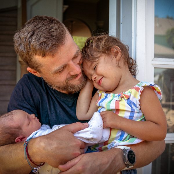 FAMILY COMMUNITY Dad hugging daughter and newborn baby together, very touching and cute, much love