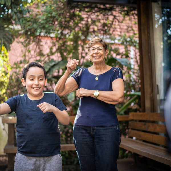 KINSHIP CARE Greek grandmother doing tik tok moves with her grand son who lives with her