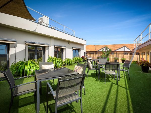 View of outdoor community space on roof of hub at Karana Retirement Living