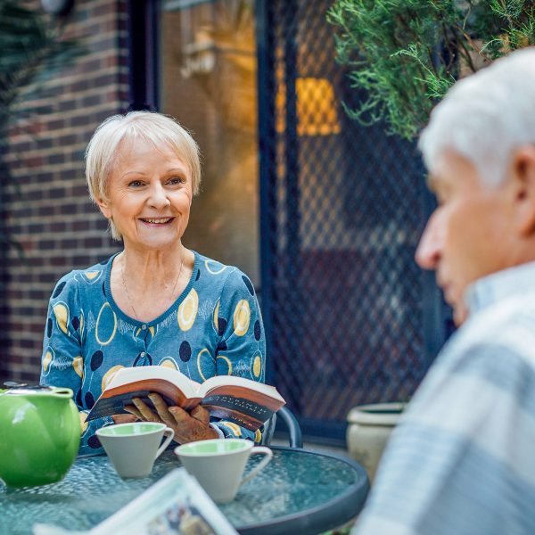 Resident outside her apartment with partner at Westhaven