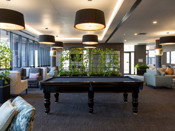 Architectural Render of the pool table at The Orchards Retirement Living community hub