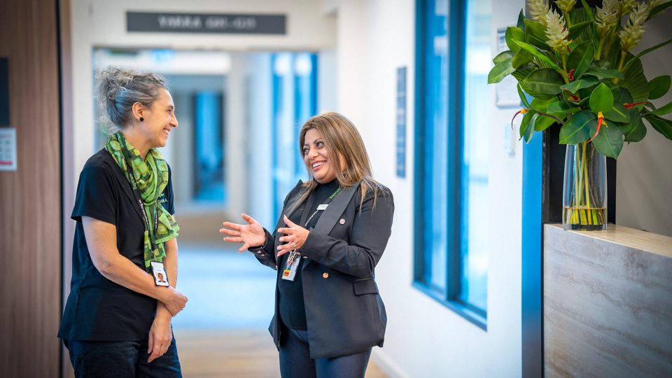 CAREERS Office Manager talking with another staff member in a residential aged care home