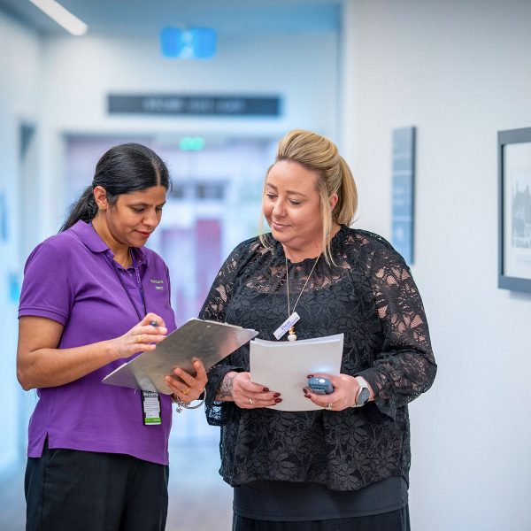 CAREERS Lifestyle Coordinator discussing activity plans with another staff member for the next month in a residential aged care home