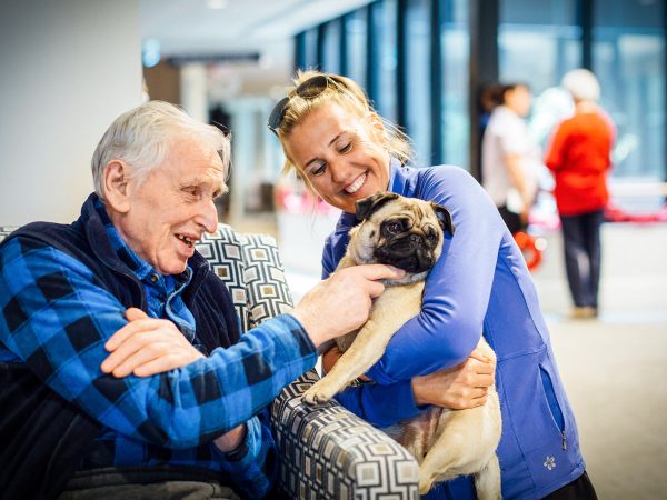 BAPTCARE THE ORCHARDS Resident with a pet doing pet therapy