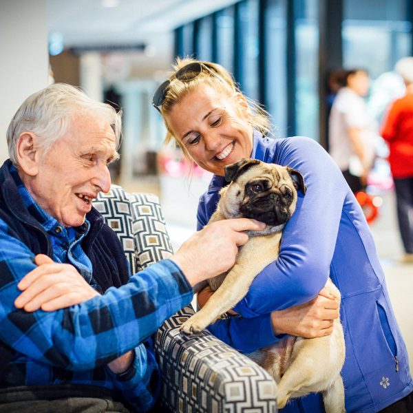 BAPTCARE THE ORCHARDS Resident with a pet doing pet therapy