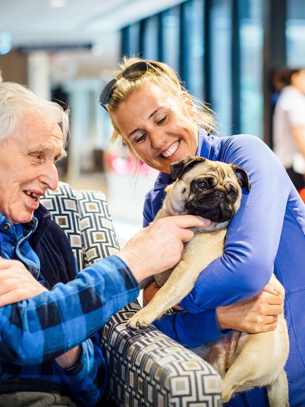 BAPTCARE THE ORCHARDS Resident with a pet doing pet therapy