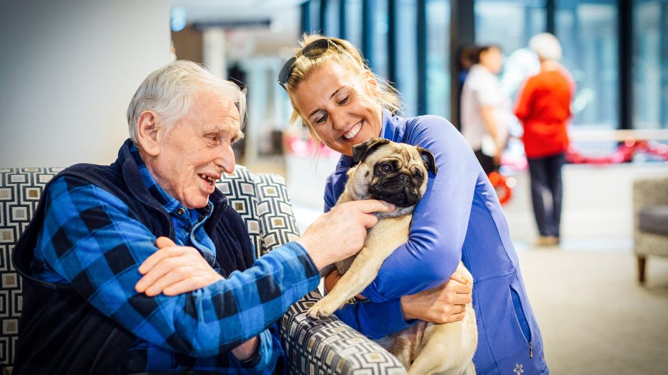 BAPTCARE THE ORCHARDS Resident with a pet doing pet therapy