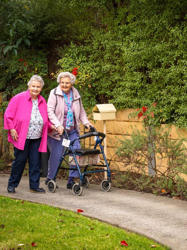 BAPTCARE STRATHALAN two residents taking a walk outside in Strathalan area