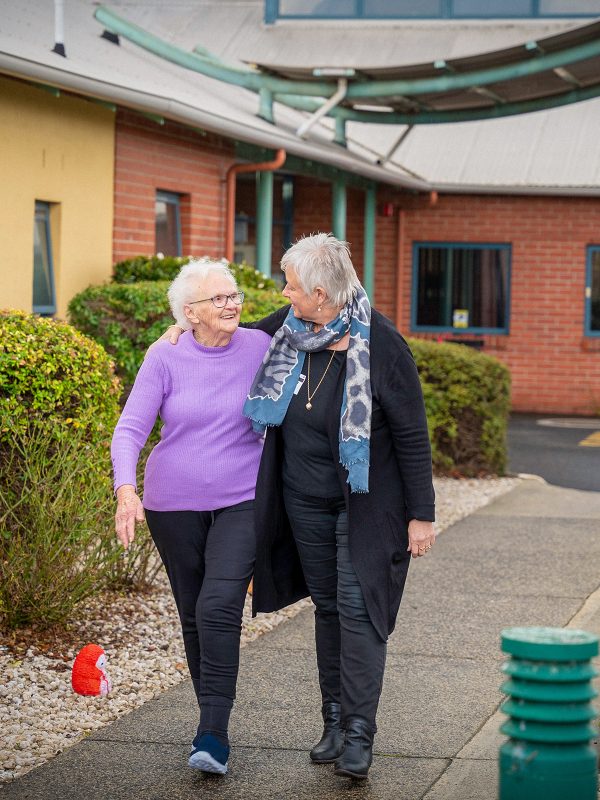 BAPTCARE KARINGAL Resident mother and daughter walking outside the main entrance