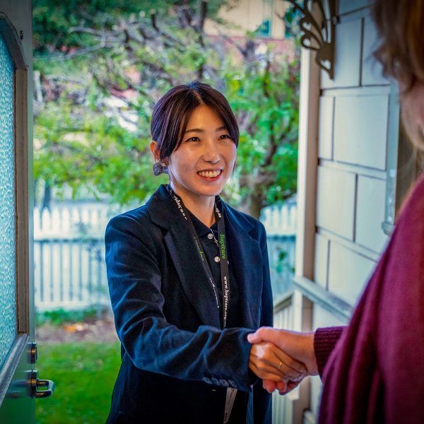 HOME CARE nursing staff member with a CHSP customer at home visit checkup being greeted at the door