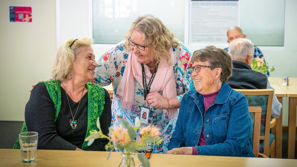 HOME CARE staff member chatting with Home Care Package customers coming for a lunchtime meal at Orana Social Activities and Respite Centre Orana