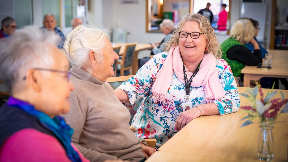 HOME CARE staff member chatting with Home Care Package customers coming for a lunchtime meal at Orana Social Activities and Respite Centre