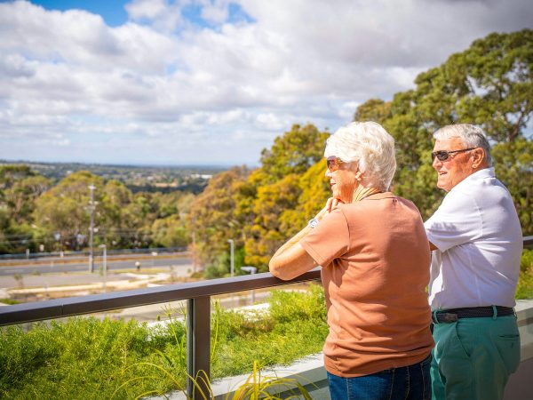 Residents at Peninsula View Retirement Living apartments on their balcony enjoying the view