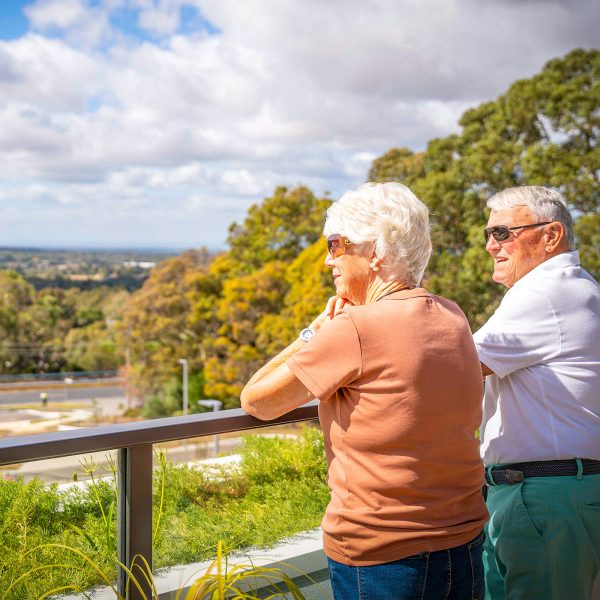 Residents at Peninsula View Retirement Living apartments on their balcony enjoying the view