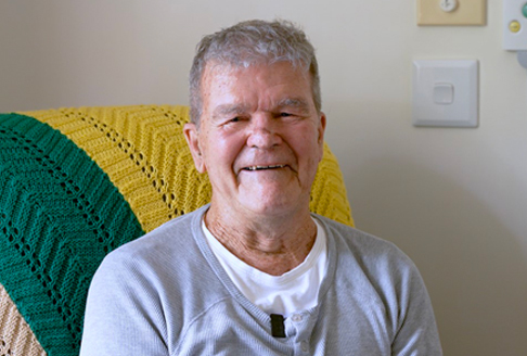 Don McLennan smiling whilst sitting down