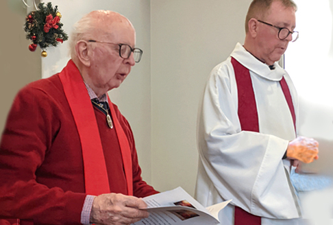 Old person dressed in red during a Sunday church service