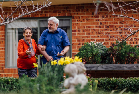 Doug and his wife in a garden