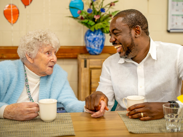 BAPTCARE NORTHAVEN Resident with staff member sharing a laugh