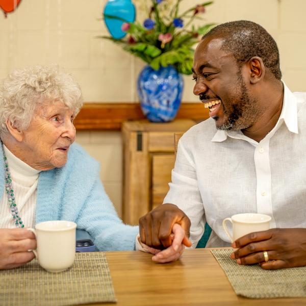 BAPTCARE NORTHAVEN Resident with staff member sharing a laugh