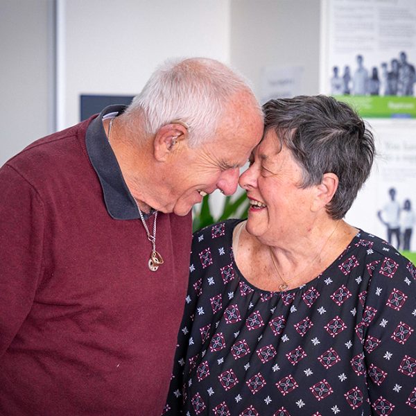 FOSTER CARERS Pam and Joe laughing portrait 2