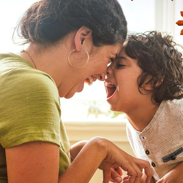 Mother and child, laughing with their for foreheads pressed together.
